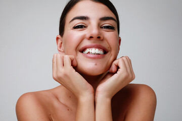 Happy young caucasian woman, posing over white background.