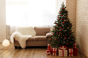 Traditionally decorated Christmas tree near the window in the corner of lofty interior apartment,...