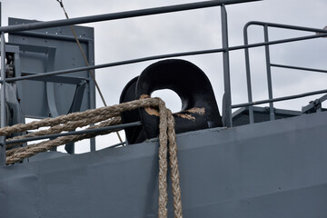 Hawsehole with the ropes dragged over the mooring lines