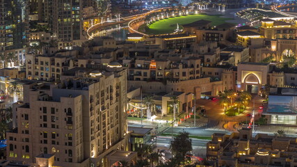 Aerial view to traditional houses of old town island night timelapse from above.