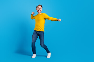 Fototapeta na wymiar Full length body size photo of funky guy wearing stylish outfit dancing looking copyspace isolated bright blue color background