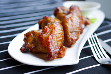 baked chicken wings drumsticks close up view