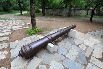The old iron cannon is in a park, Beijing