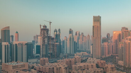 Obraz premium Dubai's business bay towers aerial morning timelapse. Rooftop view of some skyscrapers