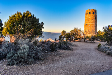 Grand Canyon National Park, Arizona, USA - November 22, 2021: Mary Colter’s Desert View Watchtower at Sunset as Seen from the South Rim of the Grand Canyon on a Late Fall Day