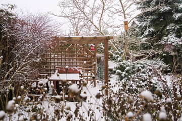 Garden with a gazebo in the winter  - 473761863