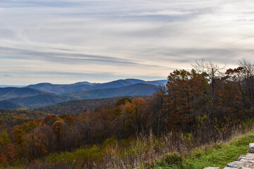 Shenandoah National Park, Virginia, USA - November 3, 2021: Mountain Scenery With Beautiful Fall Trees in the Foreground and a Bright Blue Sky in the Background