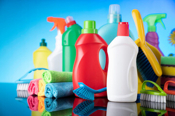 House  cleaning for Christmas. Colorful cleaning kit on blue background.