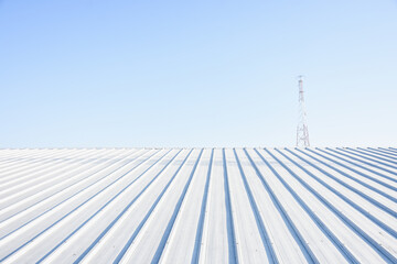 metal sheet roofing on commercial construction with blue sky	 - Powered by Adobe