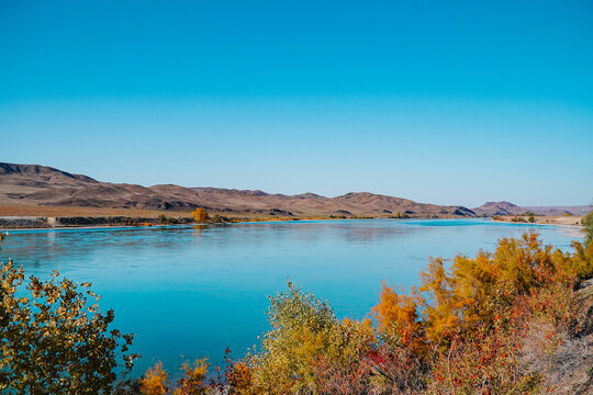 A beautiful autumn landscape of a blue river 