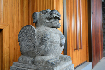 Rock carved animals at the gate of an ancient building, Beijing