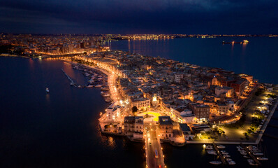 Aerial view of Taranto old city at night, Puglia. Italy