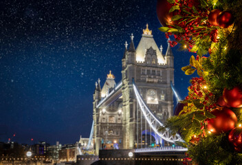 Conceptual view of the defocused Tower Bridge in London, UK, under a starry sky with colorful...