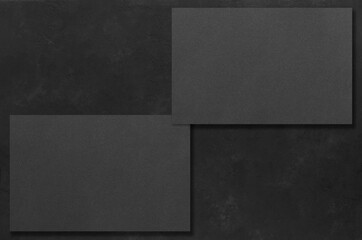 Black rectangular mockups on a dark concrete background. Design elements or portfolio. Copy space