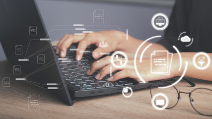 Document management, Database directory, E-document, Paperless office concept. Hand used laptop show document virtual icon and connecting line database process automation to efficiently manage file.