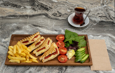 toast in wooden serving platter on marble background
