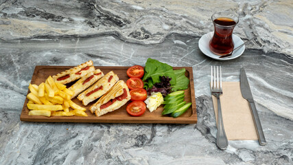 toast in wooden serving platter on marble background