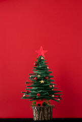 decorated Christmas tree on red background