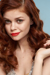 Obraz premium attractive red-haired woman red lips face close up