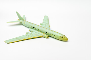 Miniature old commercial plane model on white background.Closeup.copy space.