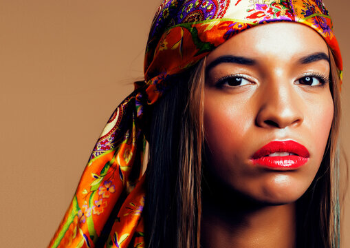 beauty bright real african woman with creative make up, shawl on head like cubian closeup smiling