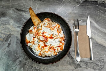 Turkish Ravioli Recipe (Mantı) on marble floor