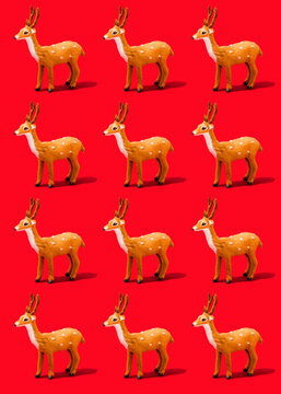 Pattern of reindeer figurines standing against vibrant red background