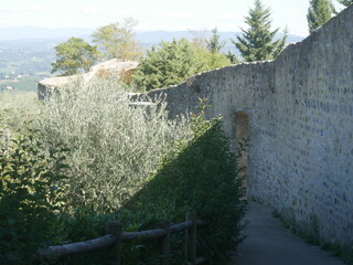 trail along the walls with towers and bulwarks that surround the historic center of San Gimignano