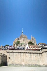 Mont saint michel architecture panoramic beautiful postcard view at Dusk in Summer Low Tide, France