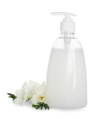 Obraz na płótnie Canvas Dispenser with liquid soap and freesia flowers on white background