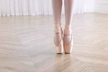Little ballerina practicing dance moves in studio, closeup of legs. Space for text