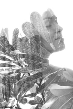 A double exposure portrait of a female model combined with an image of leaves.