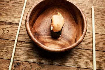 sushi on wooden plates chopsticks Japanese cuisine Asia Fish