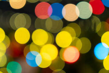 Amazing colorful bokeh, an abstract background with blurred lights or out-of-focus points of led lights, that can be used for decoration. 