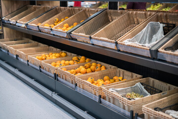 rows of raw fruits and vegetables in the supermarket