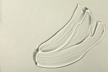 Transparent cosmetic gel on white background, top view. Space for text