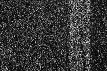 Old white line on the road texture. White line on road. Asphalt background texture with some fine grain of road.