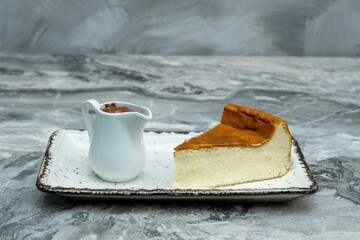 Fototapeta premium San Sebastian Cheesecake on marble floor