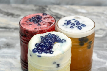 Cold drink in various flavors on a marble floor