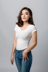 Beautiful female model . High fashion portrait&nbsp;sits in a light studio., isolated on white background.