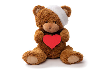medicine, healthcare and childhood concept - teddy bear toy with bandaged head holding red heart on white background