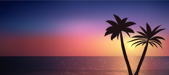 Silhouette of palm trees on a beautiful sunset over the ocean.