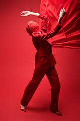 model in red pantsuit