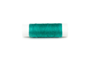 skein of colored thread on a white spool, white background