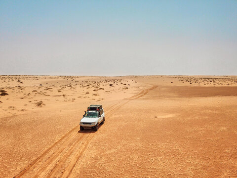 Mauritania, Banc DArguin National Park, Aerial View Of Off Road Car Driving Through Desert