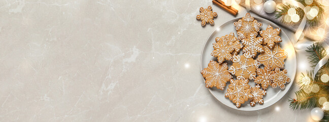 Tasty Christmas cookies and festive decor on light grey marble table, flat lay with space for text....