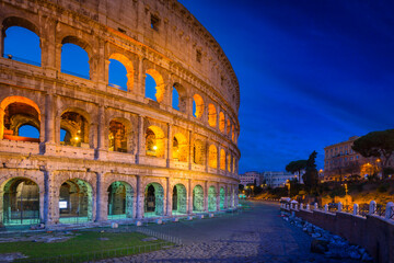 Fototapeta na wymiar The Colosseum in Rome illuminated at night, Italy