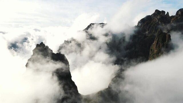 Aerial footage over the highest mountains on Madeira island. Pico do Arieiro and Pico Ruivo are very popular peaks to visit. Hikers paradise known as PR 1 trail Vereda do Areeiro. 4k footage