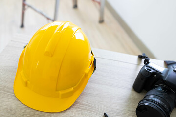 Yellow hard safety helmet for workplace construction.