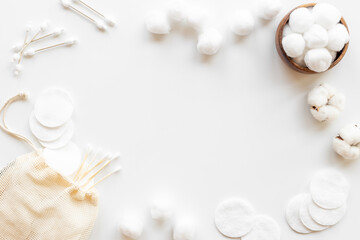 Cotton cosmetic makeup supplies - balls with cotton pads, top view